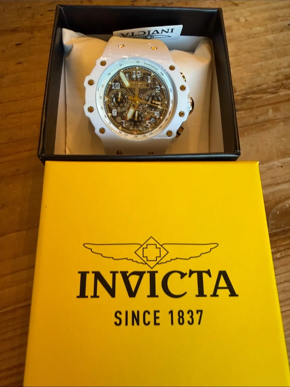 Invicta White Ceramic Skeleton Dial Watch with Gold Accents